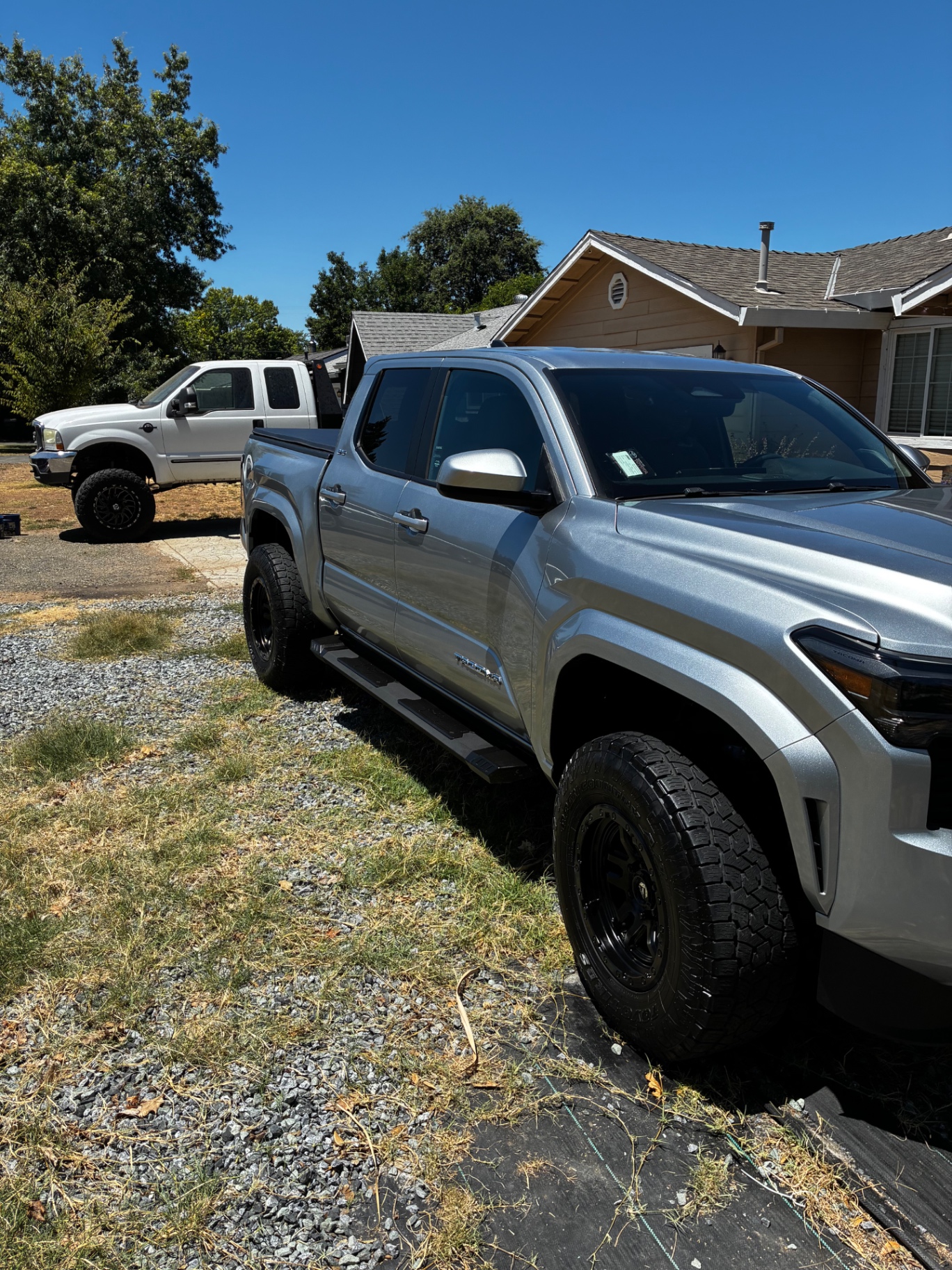 Silver Toyota Tacoma passenger-side view after Detail X exterior wash and dressing